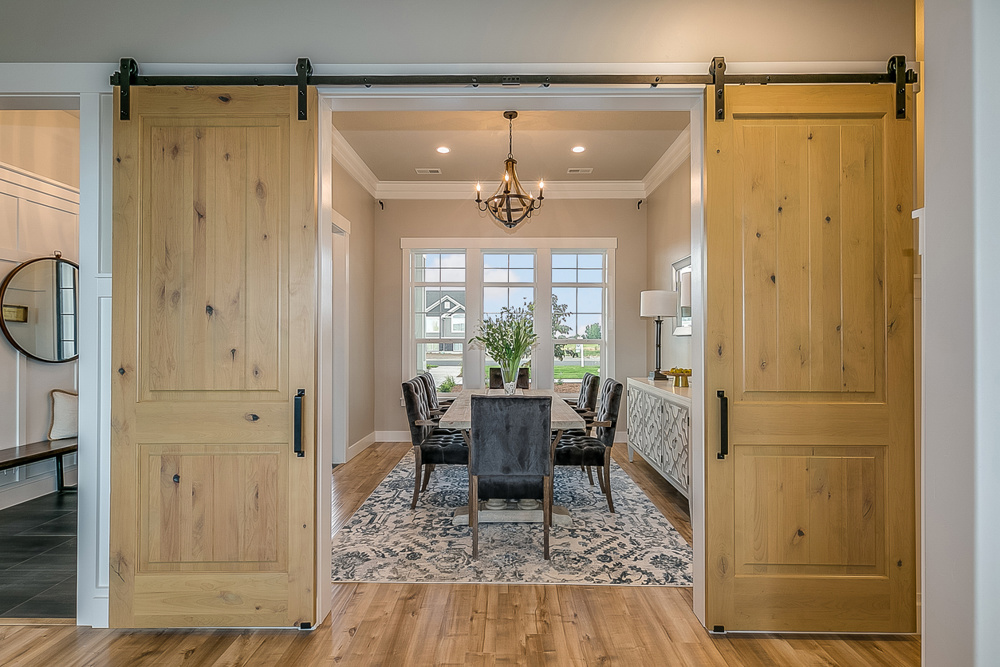 Beautiful wood barn doors and hardwood flooring give an elegant but down to earth type of feel